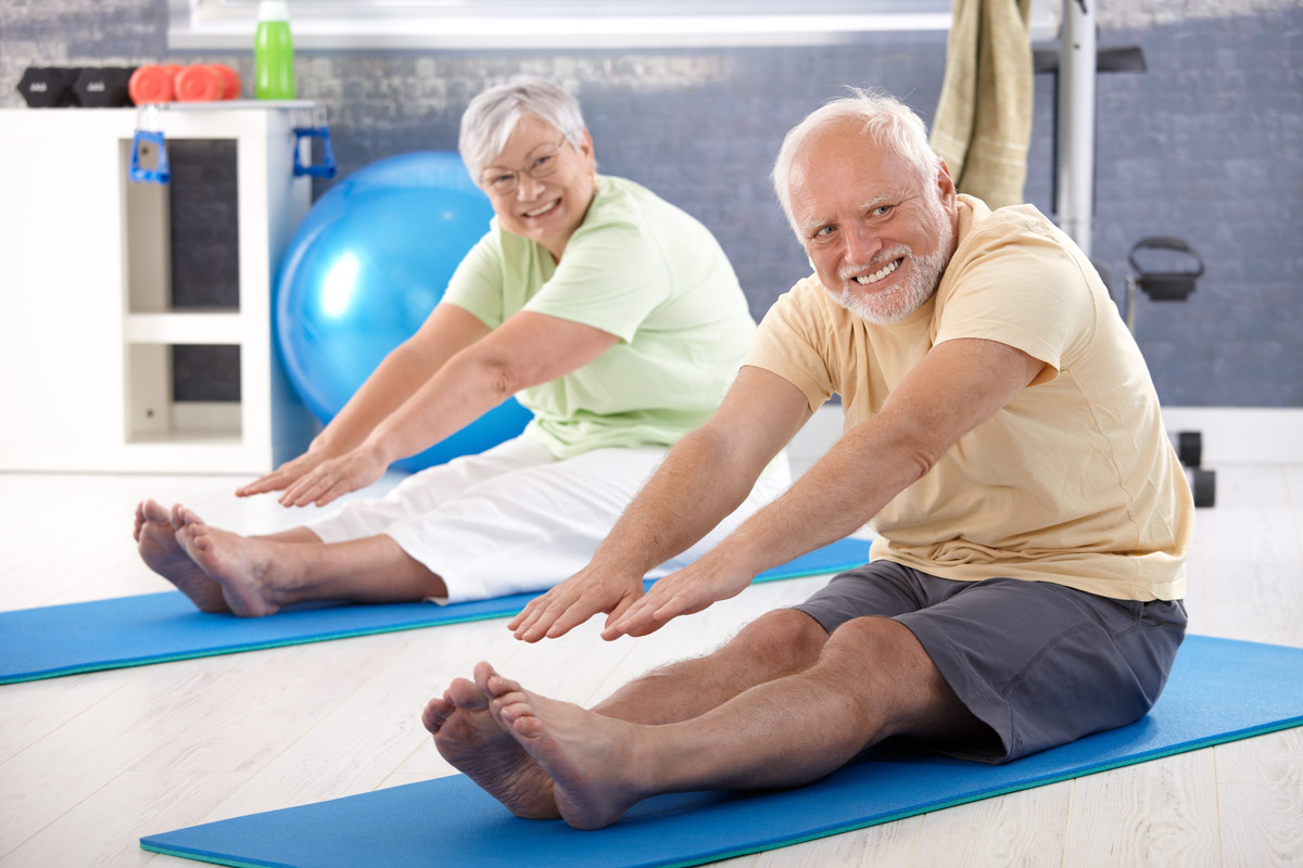 Orchard Gardens retirement community seniors performing stretches and exercises