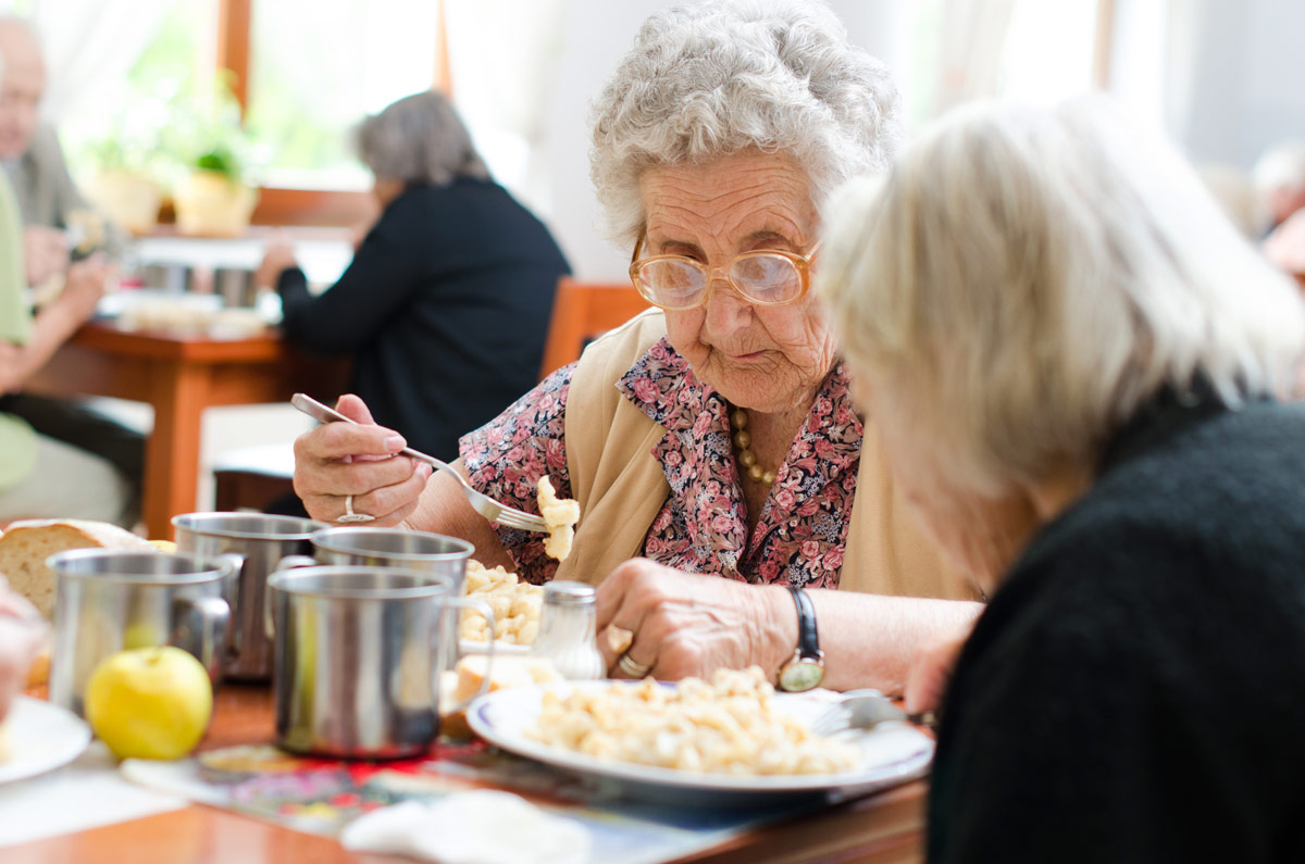 Senior Eating a Meal at Kelowna Seniors Independent Living Community