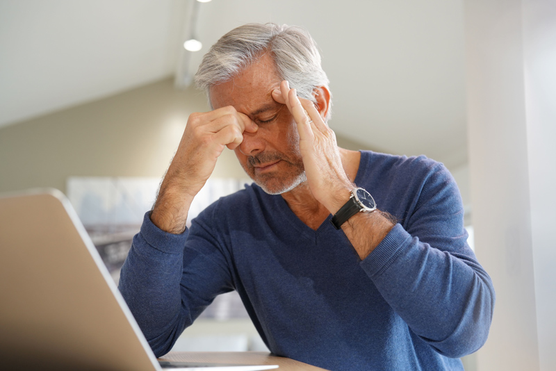 Senior with headache pain at an independent or assisted living community in Kelowna