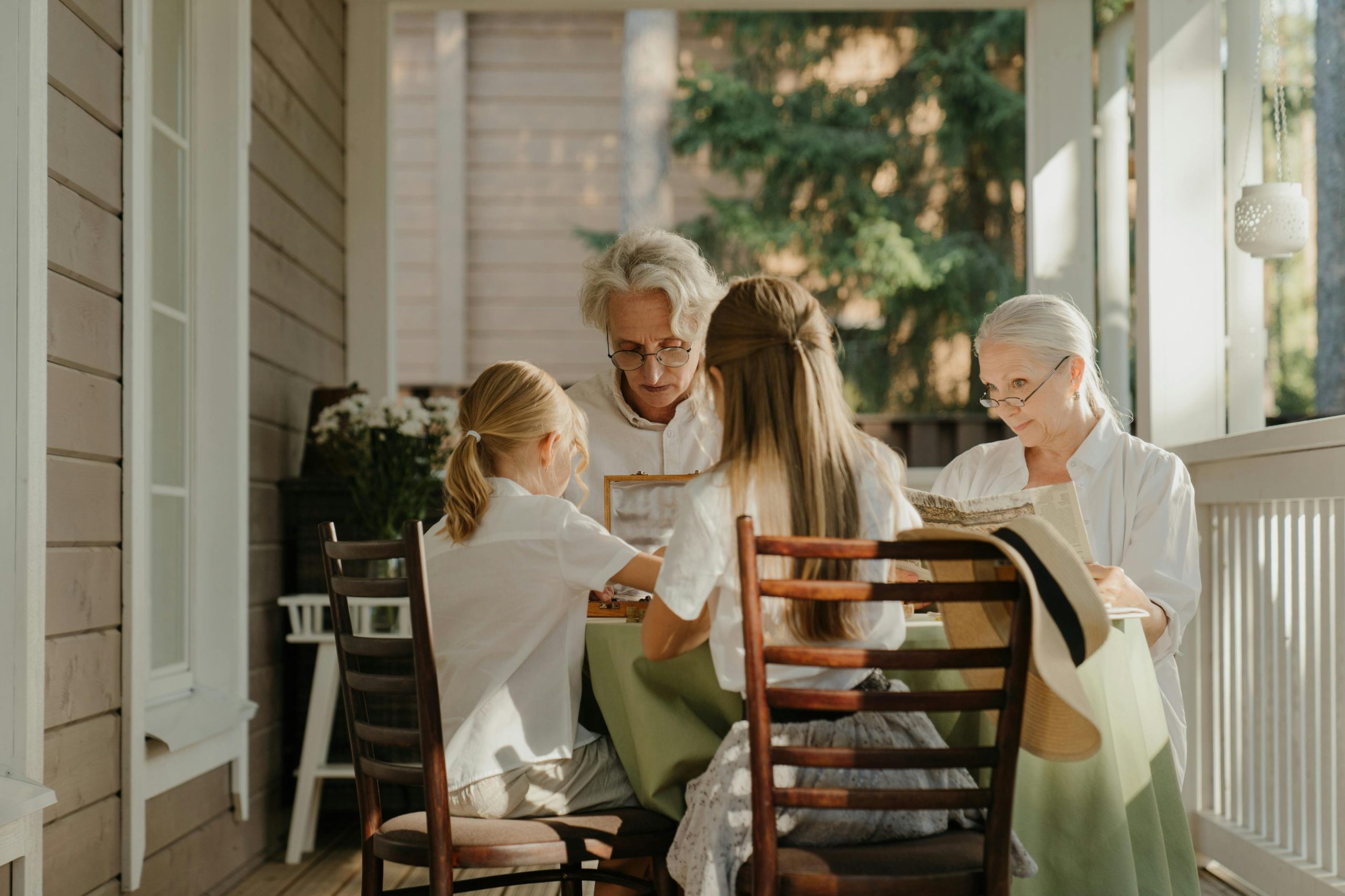 grandparents playing games with grandchildren at a table